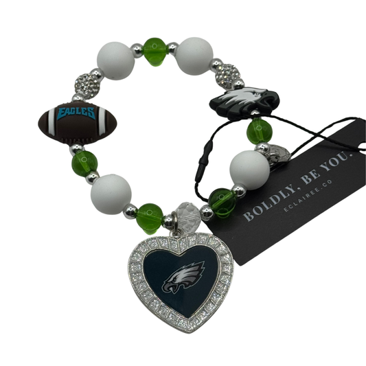 Bracelet with heart-shaped Philadelphia Eagles charm on a white background